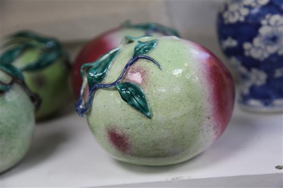 A pair of Chinese enamelled porcelain models of peaches, 19th century, length 16.5cm